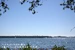 3 sails, seen from shore.